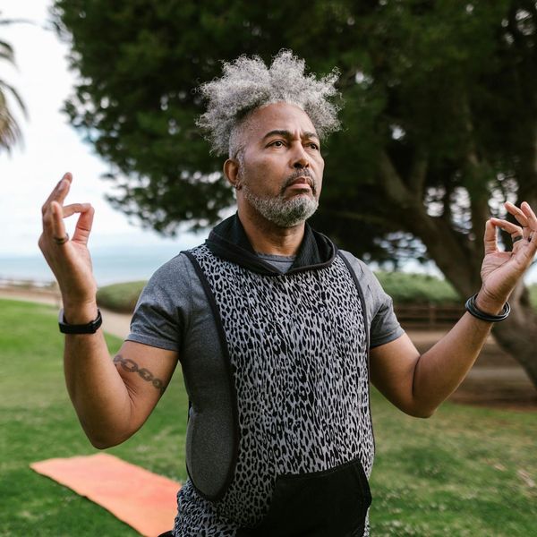 A serene person meditating in a calm environment, symbolizing inner peace.